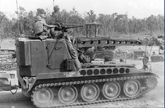 In the early years of Vietnam, many combat units were deployed ahead of their supporting logistics units. Logistics infrastructure had to be built up while the fighting was ongoing. This M578 Light Recovery Vehicle is doing its work with two (vice the standard one) .50 caliber machine gun mounted on the cab.