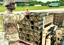 An 89B Ammunition Specialist student is conducting hand and arms signals during “Move Munitions with a Forklift” training.