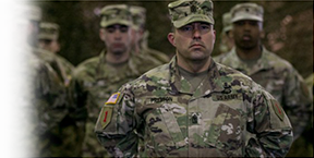 Soldiers in formation standing at parade rest. (Photo Credit: U.S. Army)